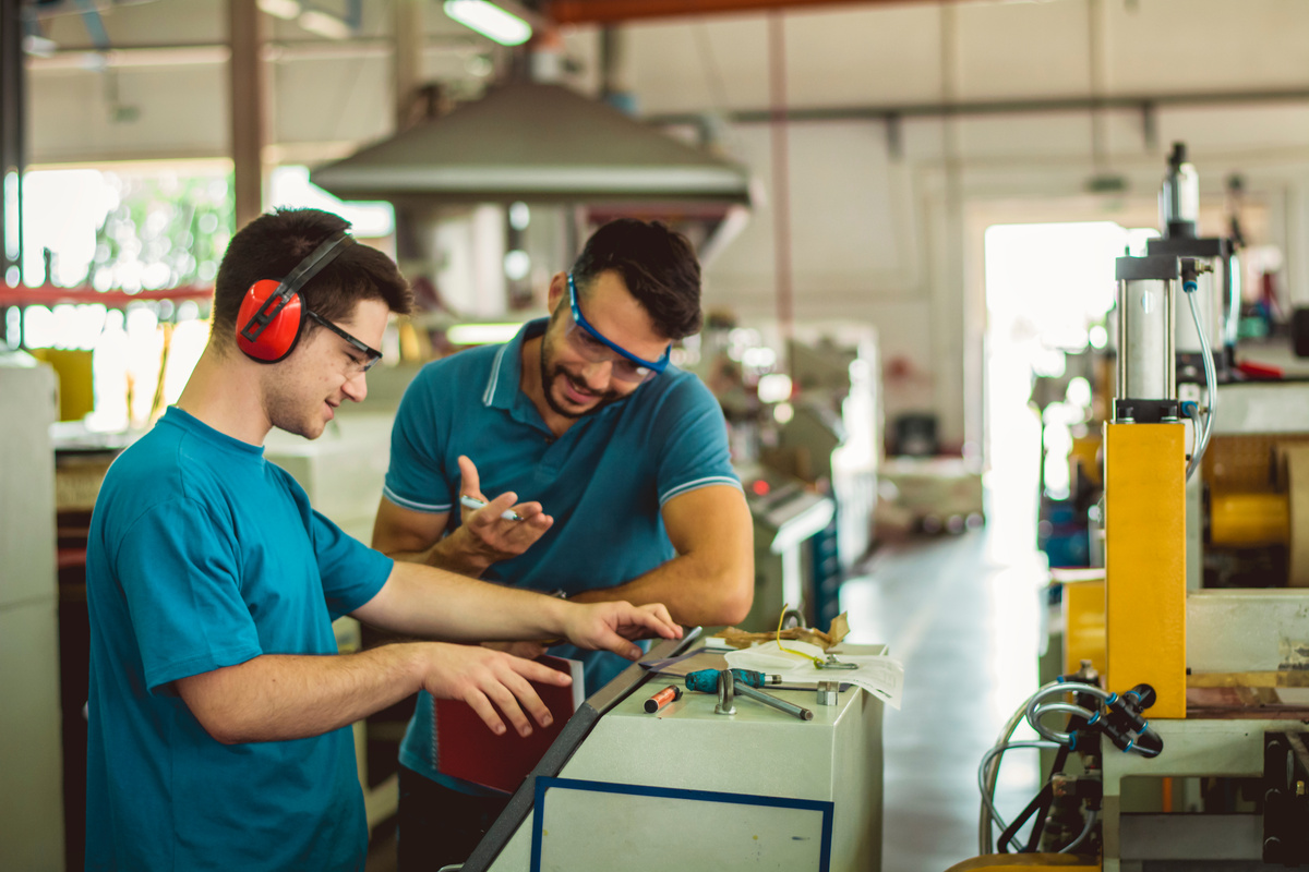 People at work. Industrial manufacture indoors.